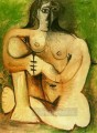 Femme nue accroupie sur fond vert 1960 Cubism